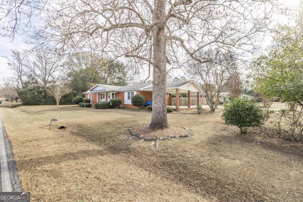 188 Lewis Street Cochran, GA 31014 - Photo 37 of 46 a view of house with a yard covered in snow