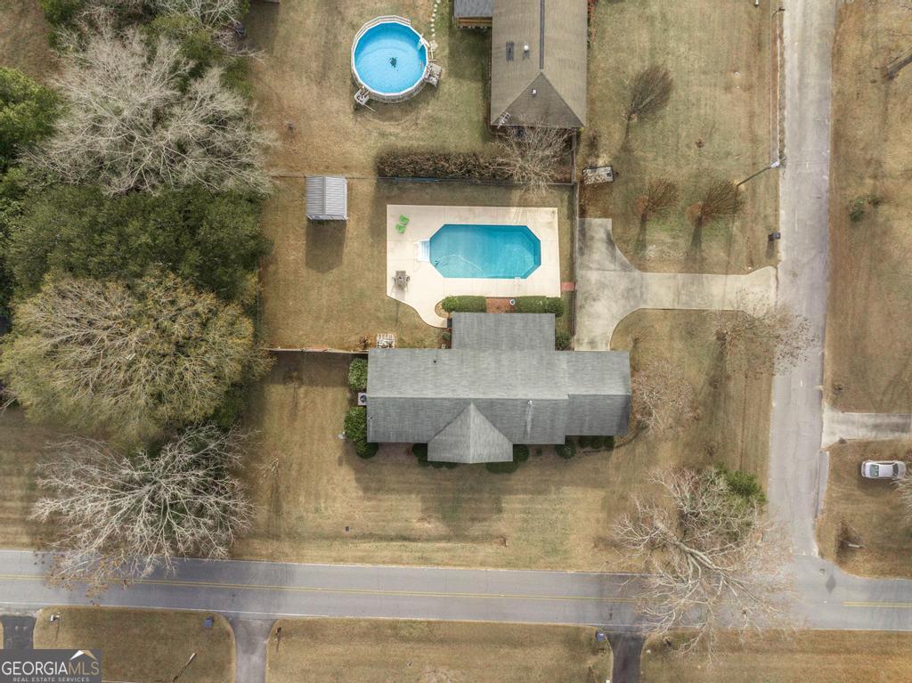 188 Lewis Street Cochran, GA 31014 - Photo 44 of 46 a bathroom with a sink and a mirror