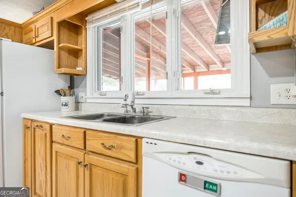 a bathroom with a sink and a window