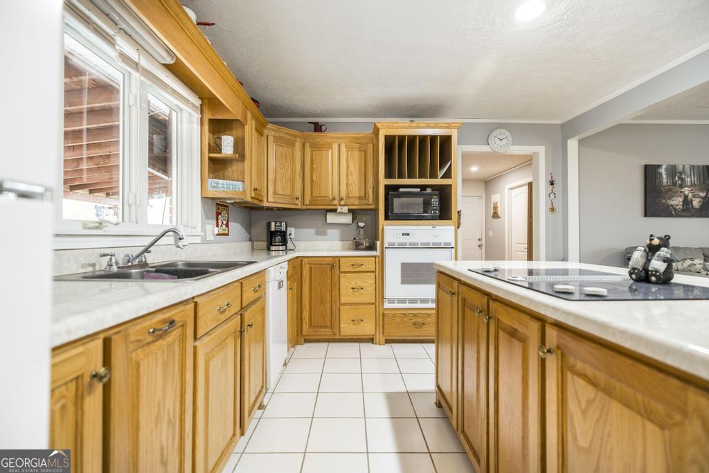 188 Lewis Street Cochran, GA 31014 - Photo 10 of 46 a kitchen with stainless steel appliances granite countertop a sink and cabinets