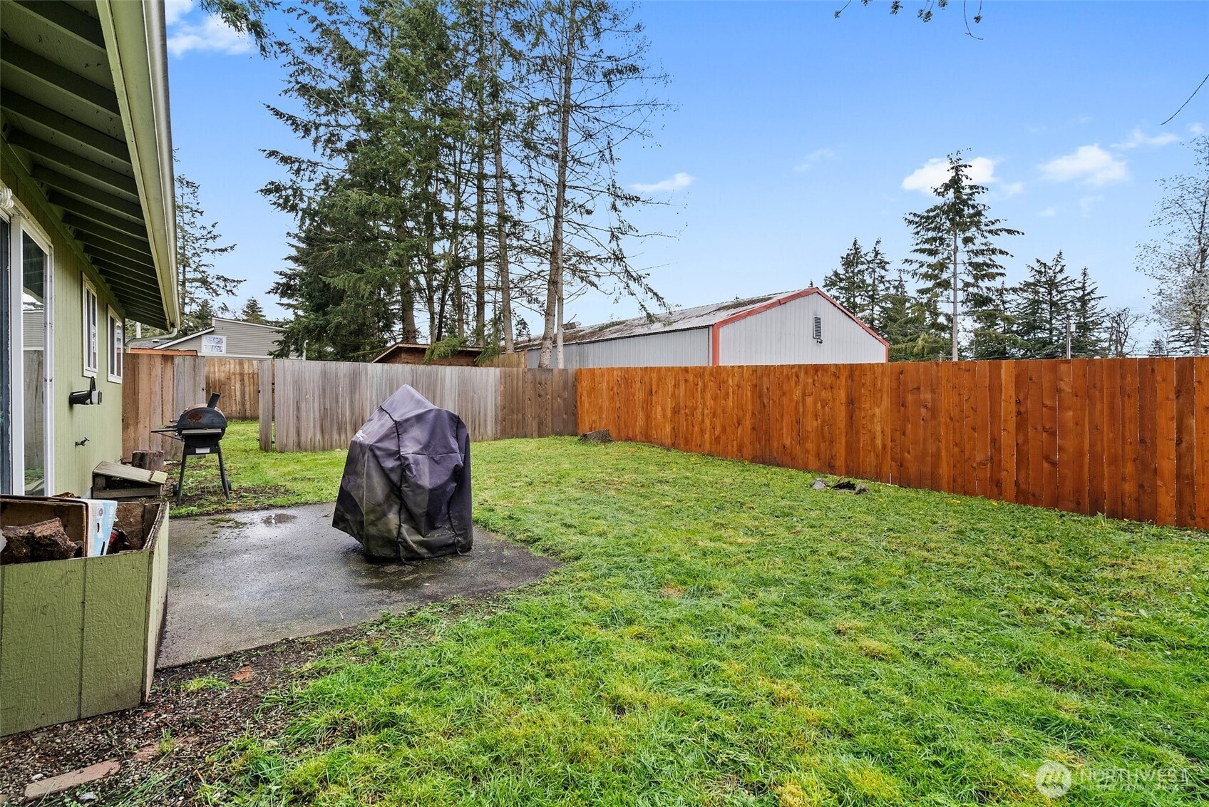 10227-10229 Ainsworth Avenue South Tacoma, WA 98444 - Photo 15 of 23 a view of backyard with a garden and entertaining space