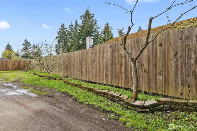 a backyard of a house with lots of green space