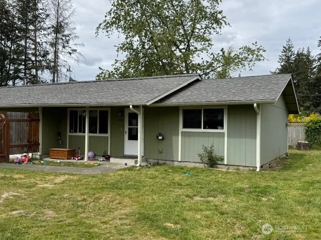 a front view of a house with a garden and porch