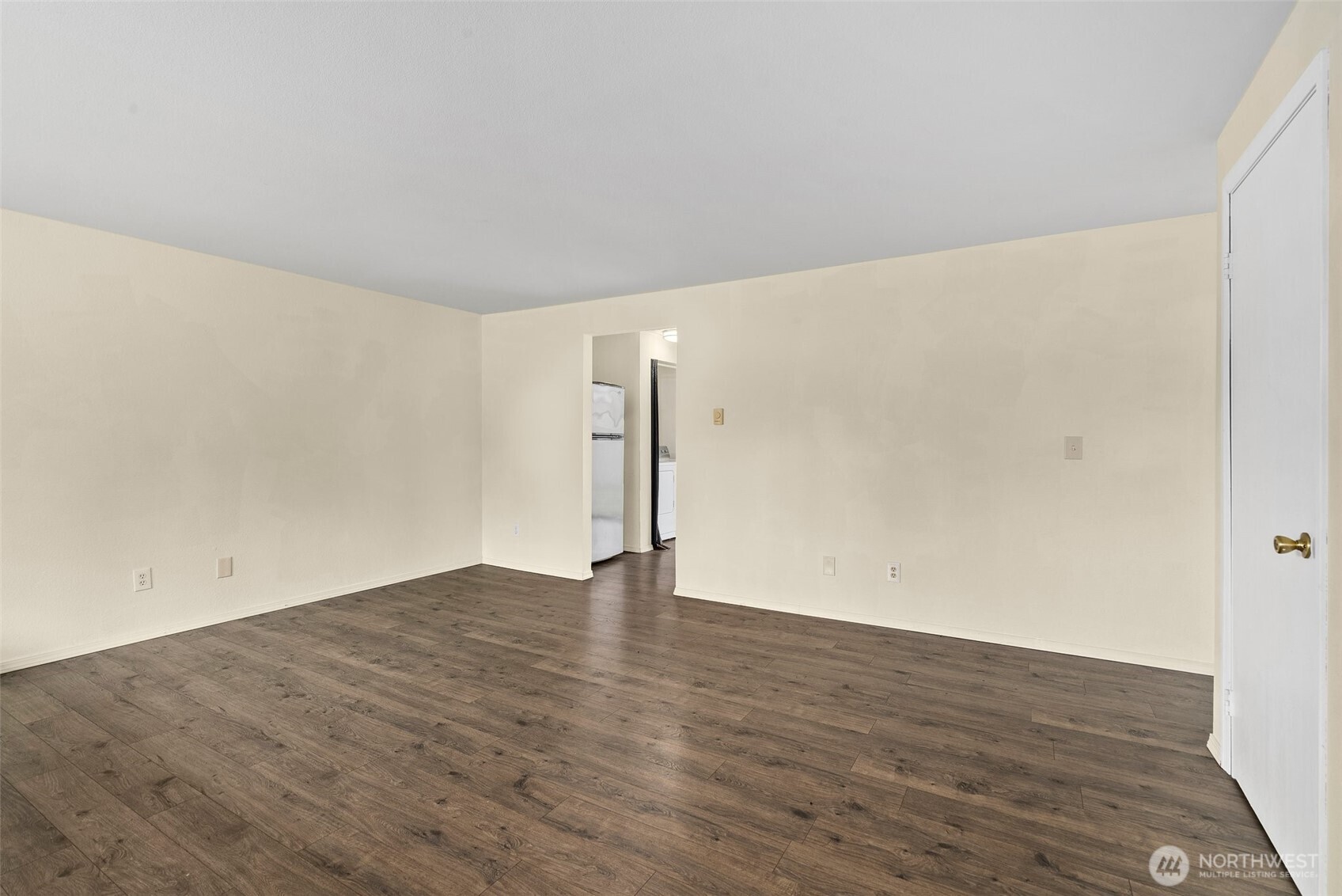 10227-10229 Ainsworth Avenue South Tacoma, WA 98444 - Photo 7 of 23 a view of an empty room with wooden floor