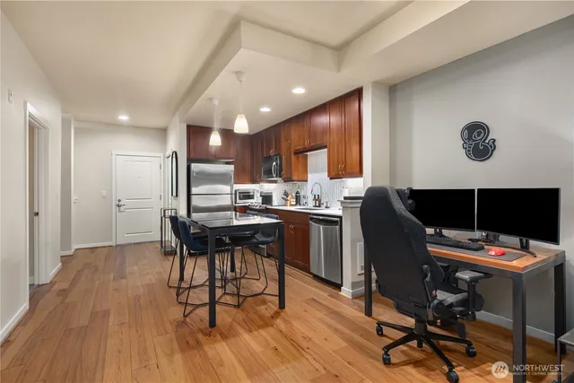 a kitchen with a table and chairs in it