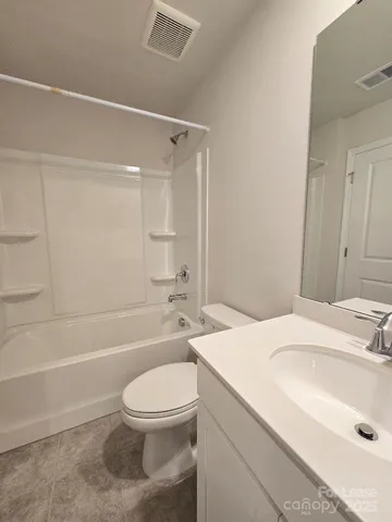 a bathroom with a sink a toilet and a bathtub