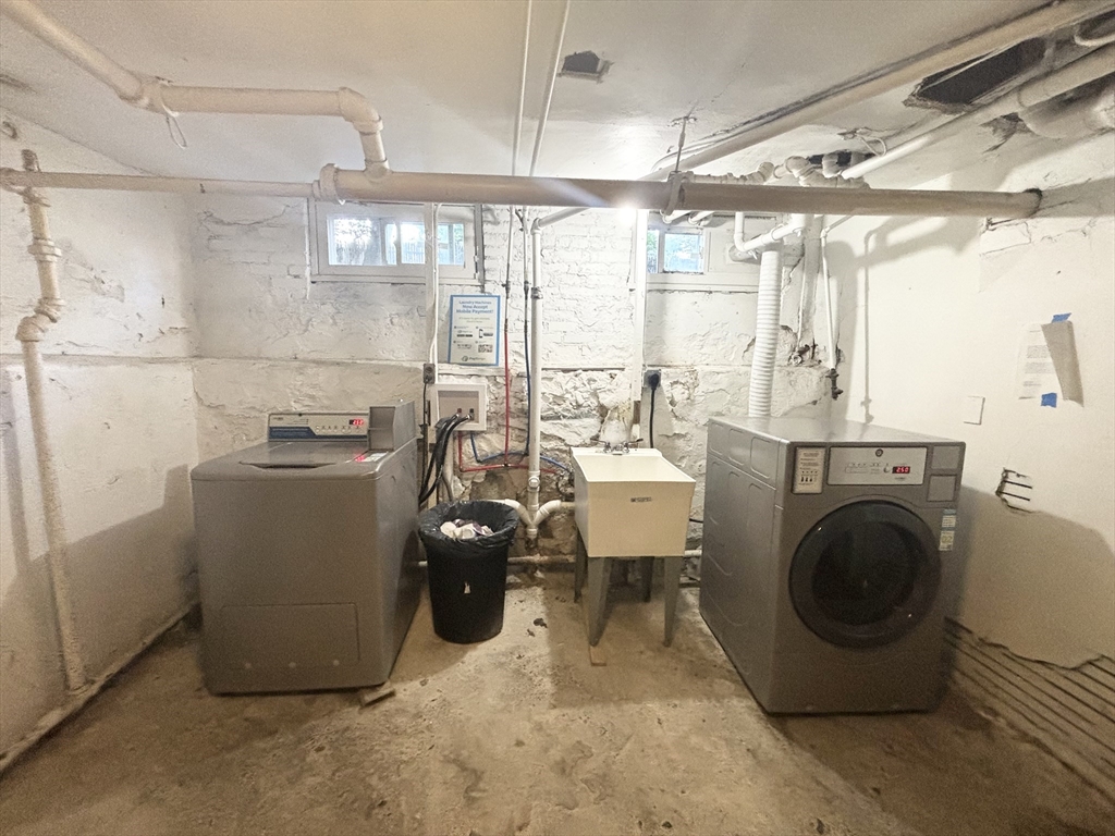 36 Spring Street, Unit 11 Malden, MA 02148 - Photo 12 of 12 a view of a storage & utility room with two washing machine