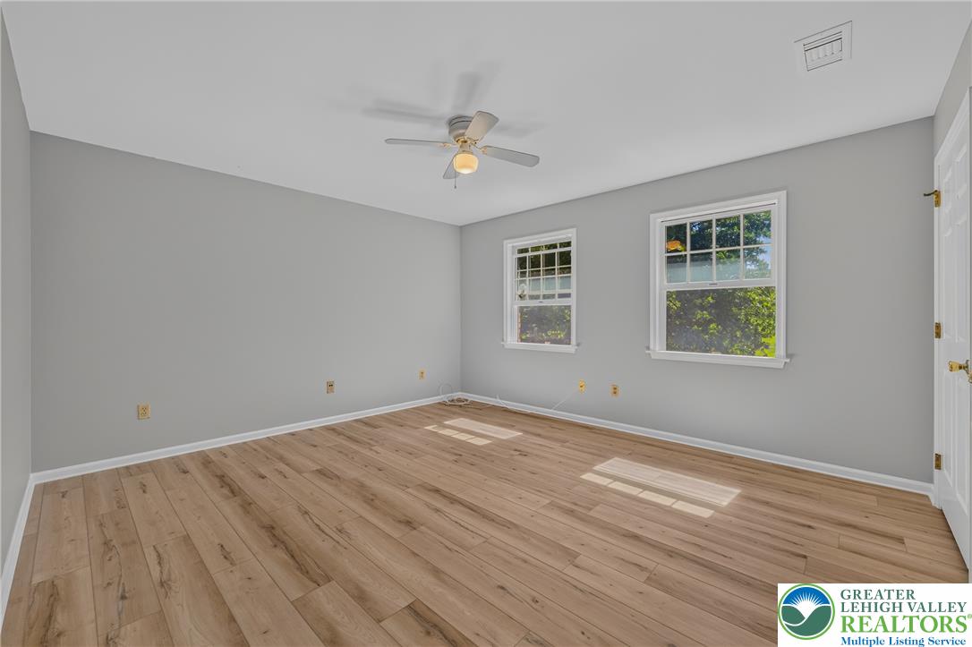 630 Clearfield Road Nazareth, PA 18064 - Photo 54 of 100 Warm wood flooring and natural light through classic windows define this versatile living space.