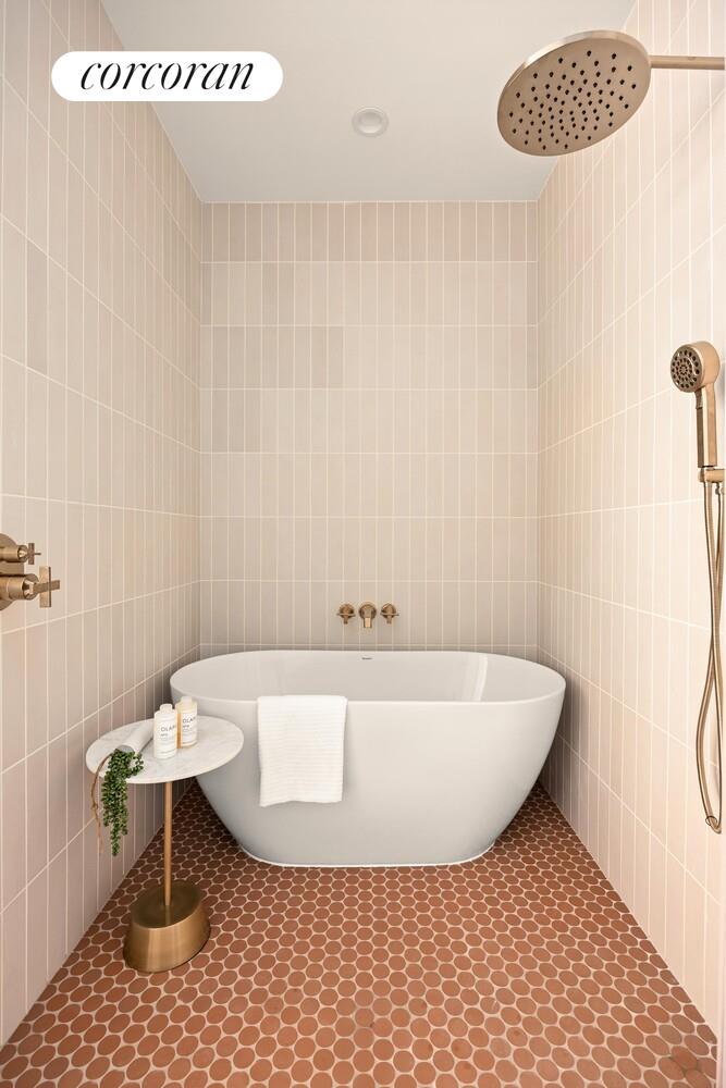 103 Putnam Avenue, Unit 1B Brooklyn, NY 11238 - Photo 10 of 13 a bathroom with a sink a toilet and a shower curtain