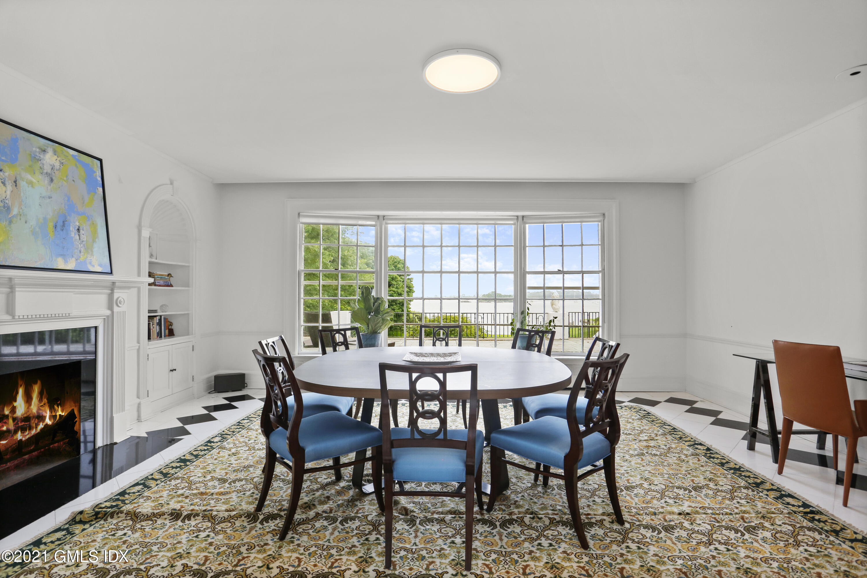 91 Indian Head Road Riverside, CT 06878 - Photo 12 of 45 a view of a dining room with furniture window and wooden floor