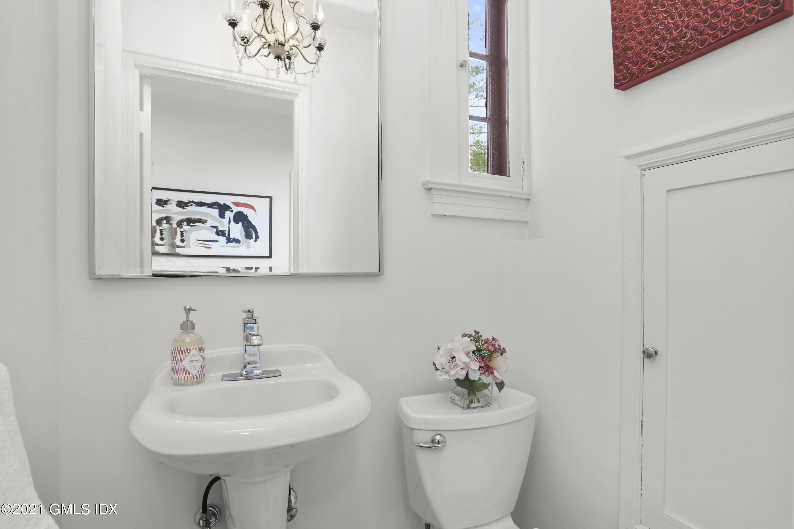 91 Indian Head Road Riverside, CT 06878 - Photo 19 of 45 a bathroom with a sink mirror and toilet