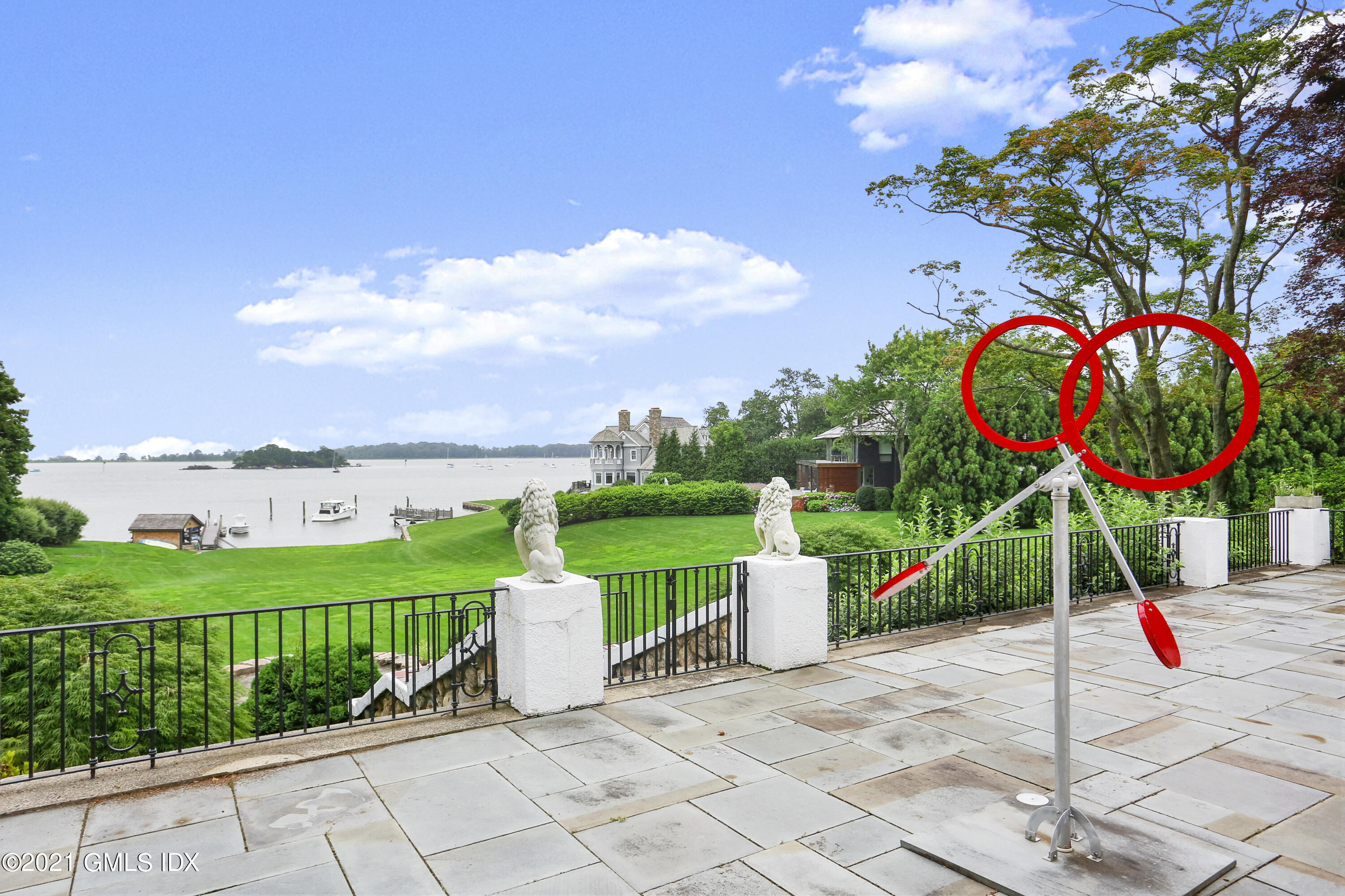 91 Indian Head Road Riverside, CT 06878 - Photo 2 of 45 a view of a park with iron fence