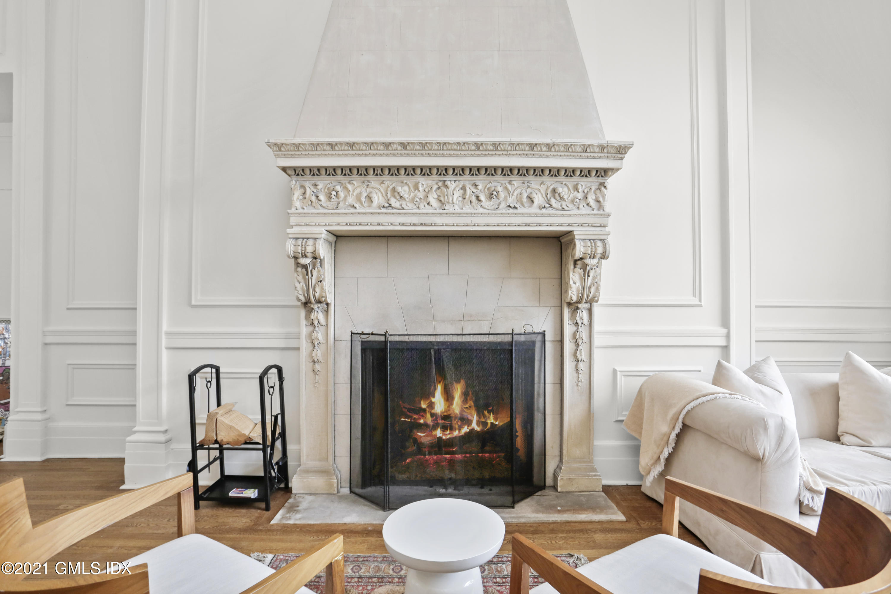 91 Indian Head Road Riverside, CT 06878 - Photo 23 of 45 a living room with furniture and a fireplace