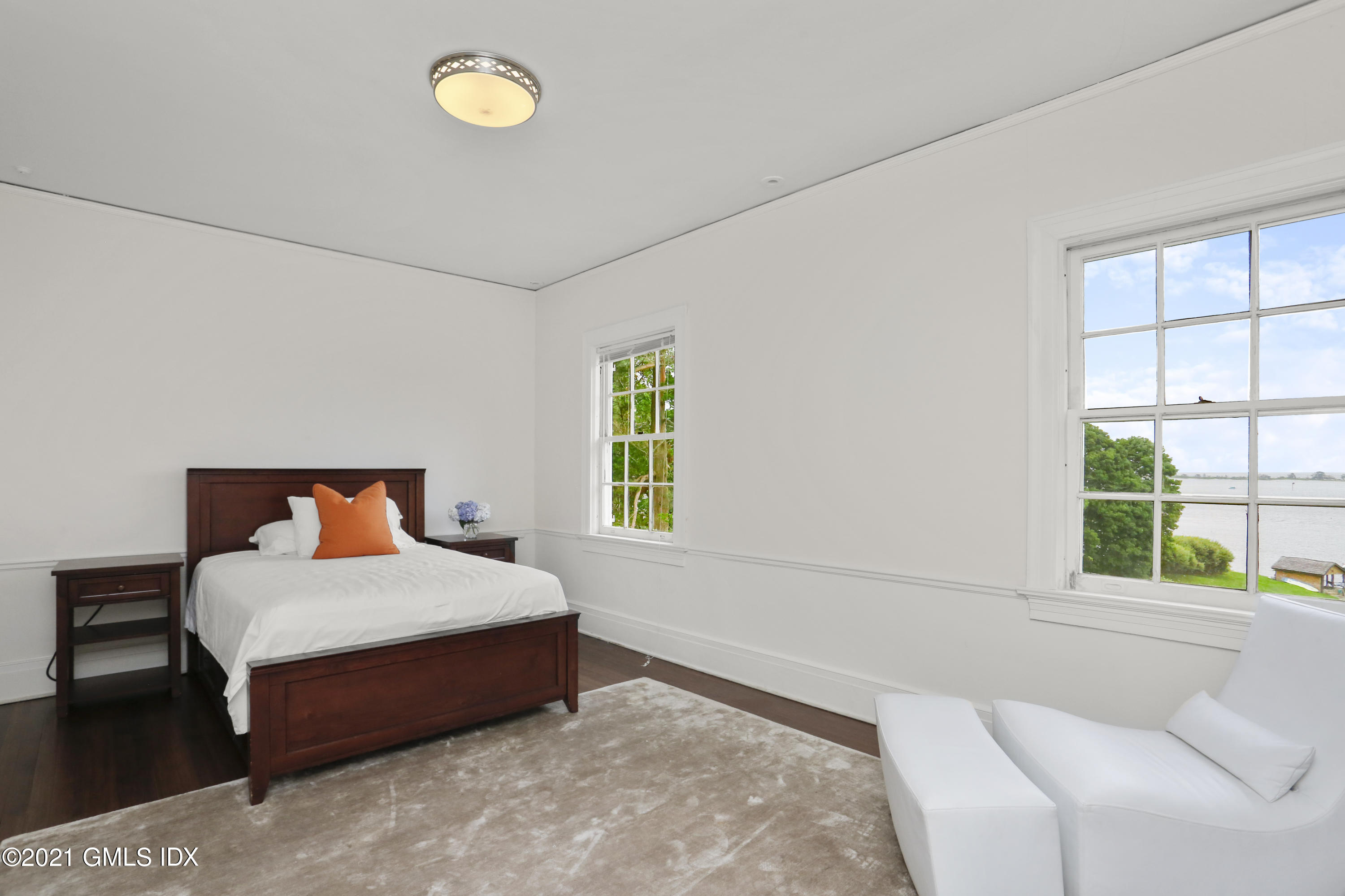 91 Indian Head Road Riverside, CT 06878 - Photo 32 of 45 a bedroom with a bed and window
