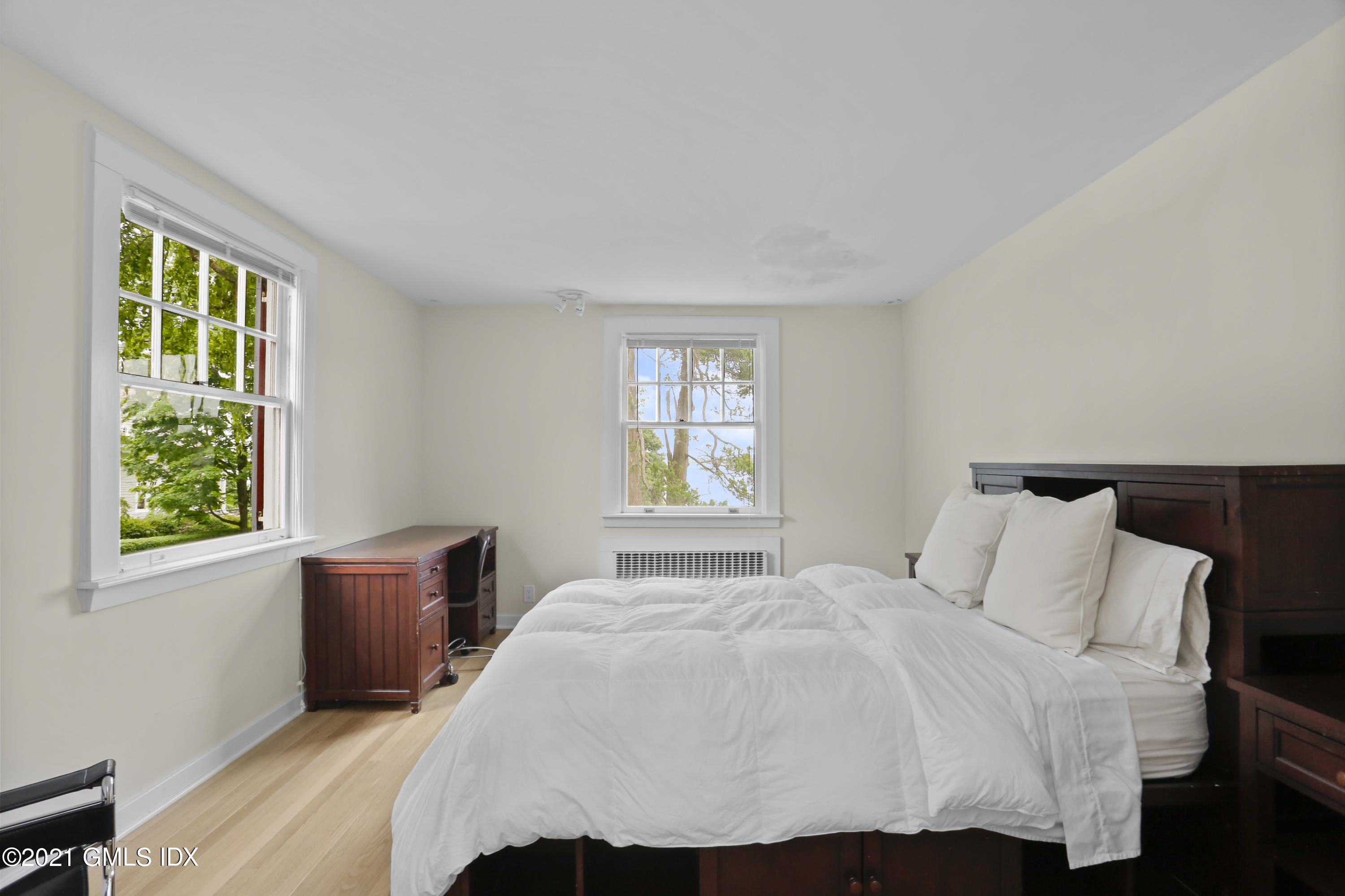 91 Indian Head Road Riverside, CT 06878 - Photo 34 of 45 a bedroom with a bed and window