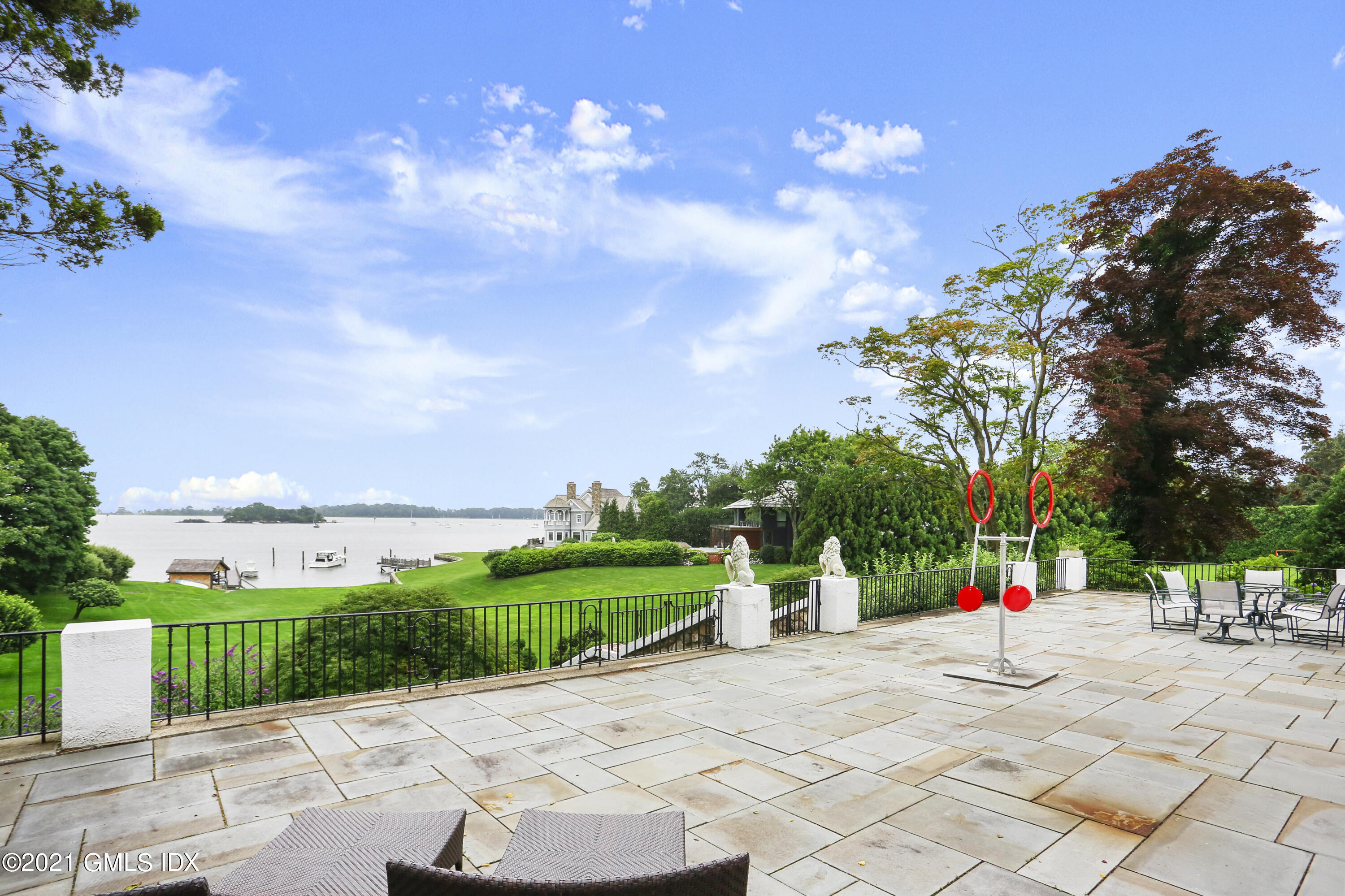 91 Indian Head Road Riverside, CT 06878 - Photo 39 of 45 a park view with a fountain and a fire pit