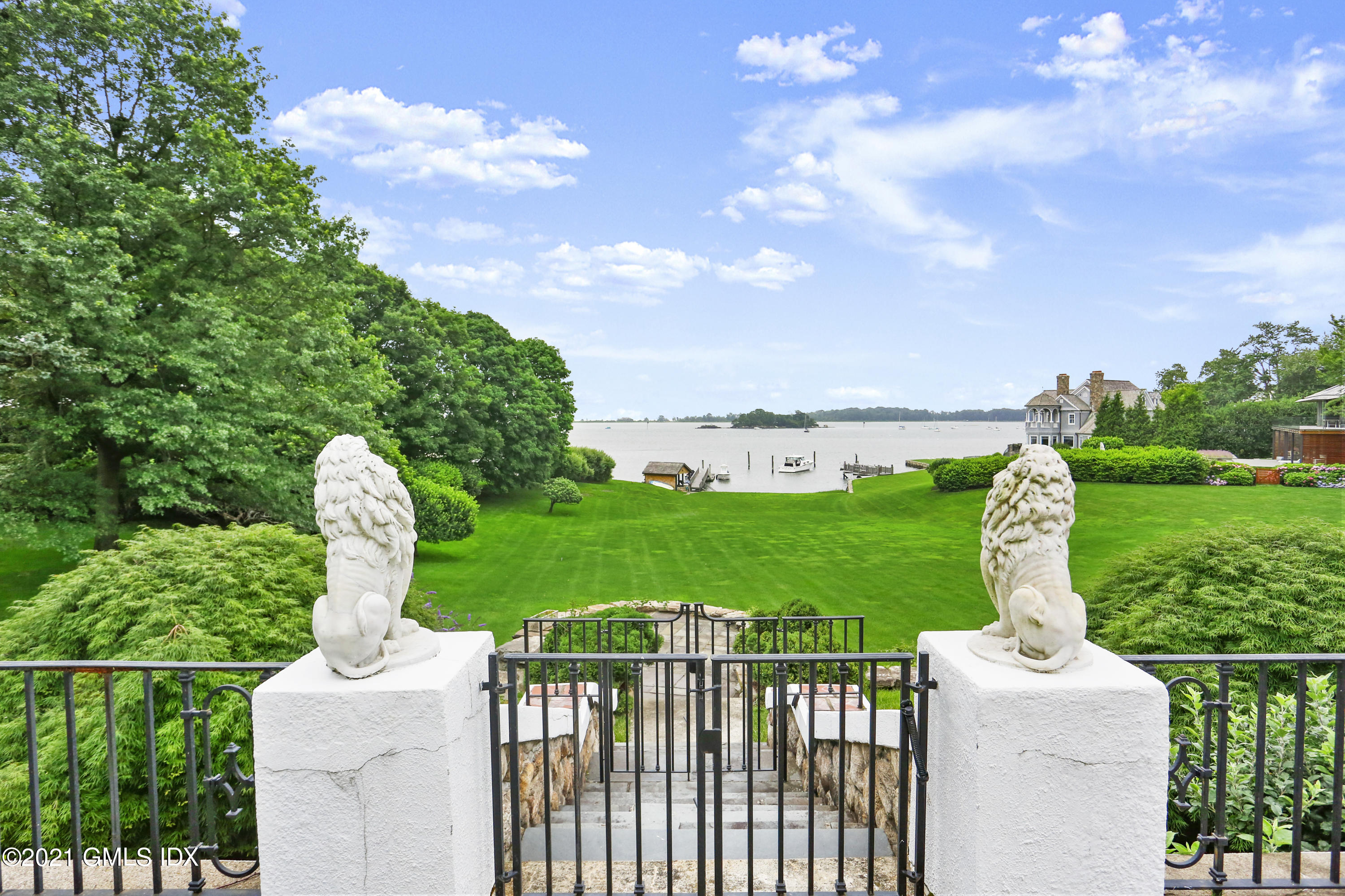 91 Indian Head Road Riverside, CT 06878 - Photo 40 of 45 a view of a garden with plants and large trees