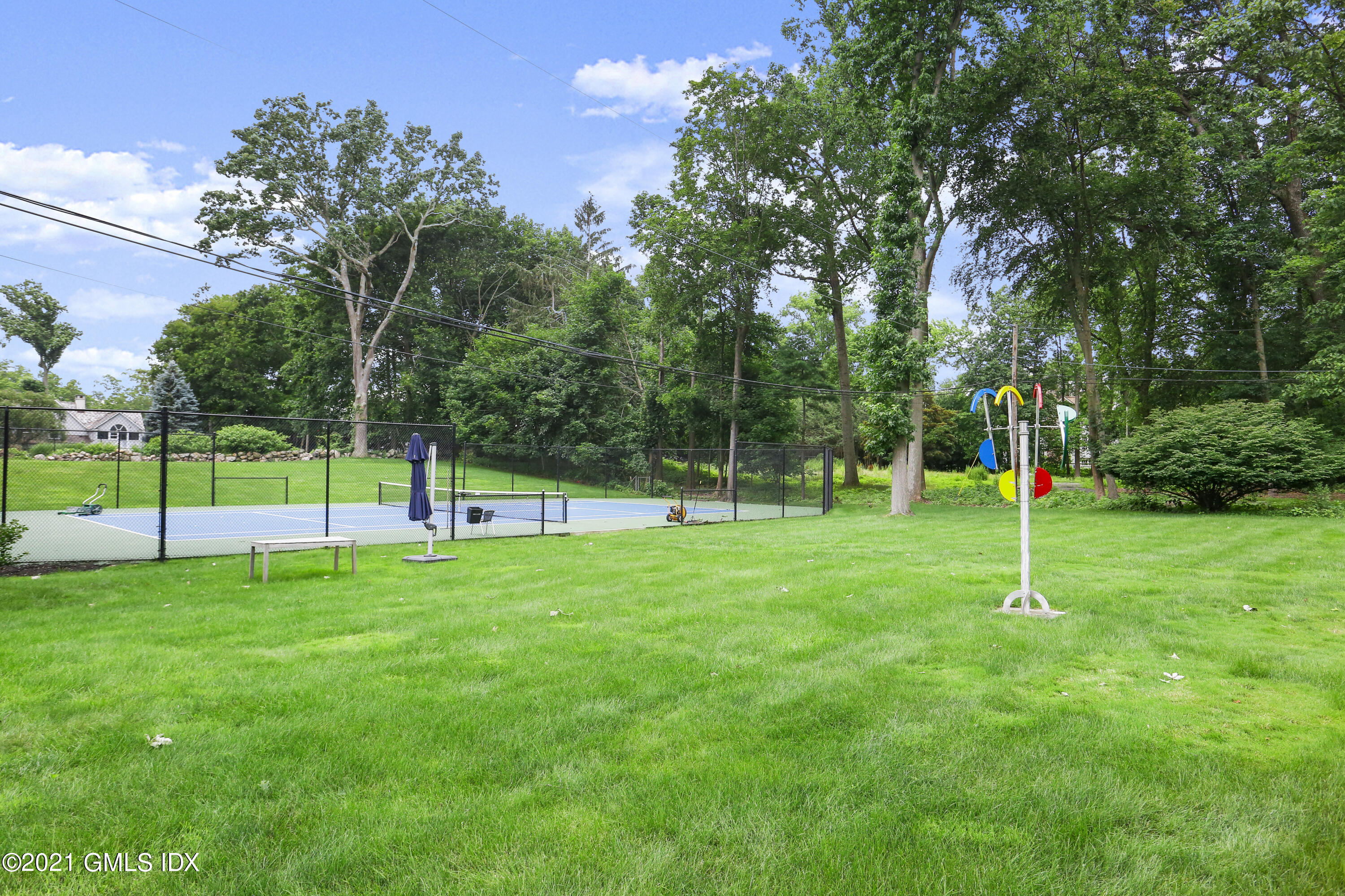 91 Indian Head Road Riverside, CT 06878 - Photo 45 of 45 a house view with a backyard