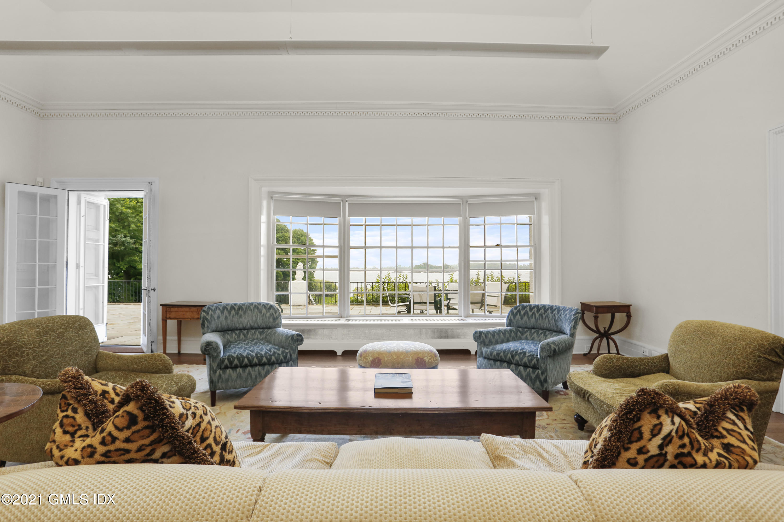 91 Indian Head Road Riverside, CT 06878 - Photo 6 of 45 a living room with furniture and a large window