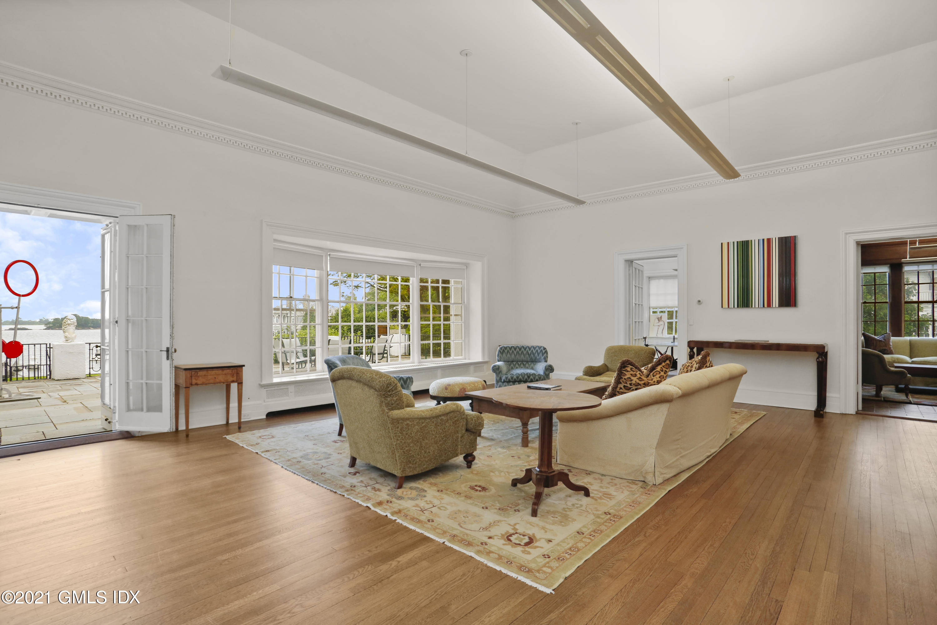 91 Indian Head Road Riverside, CT 06878 - Photo 8 of 45 a living room with furniture and a wooden floor