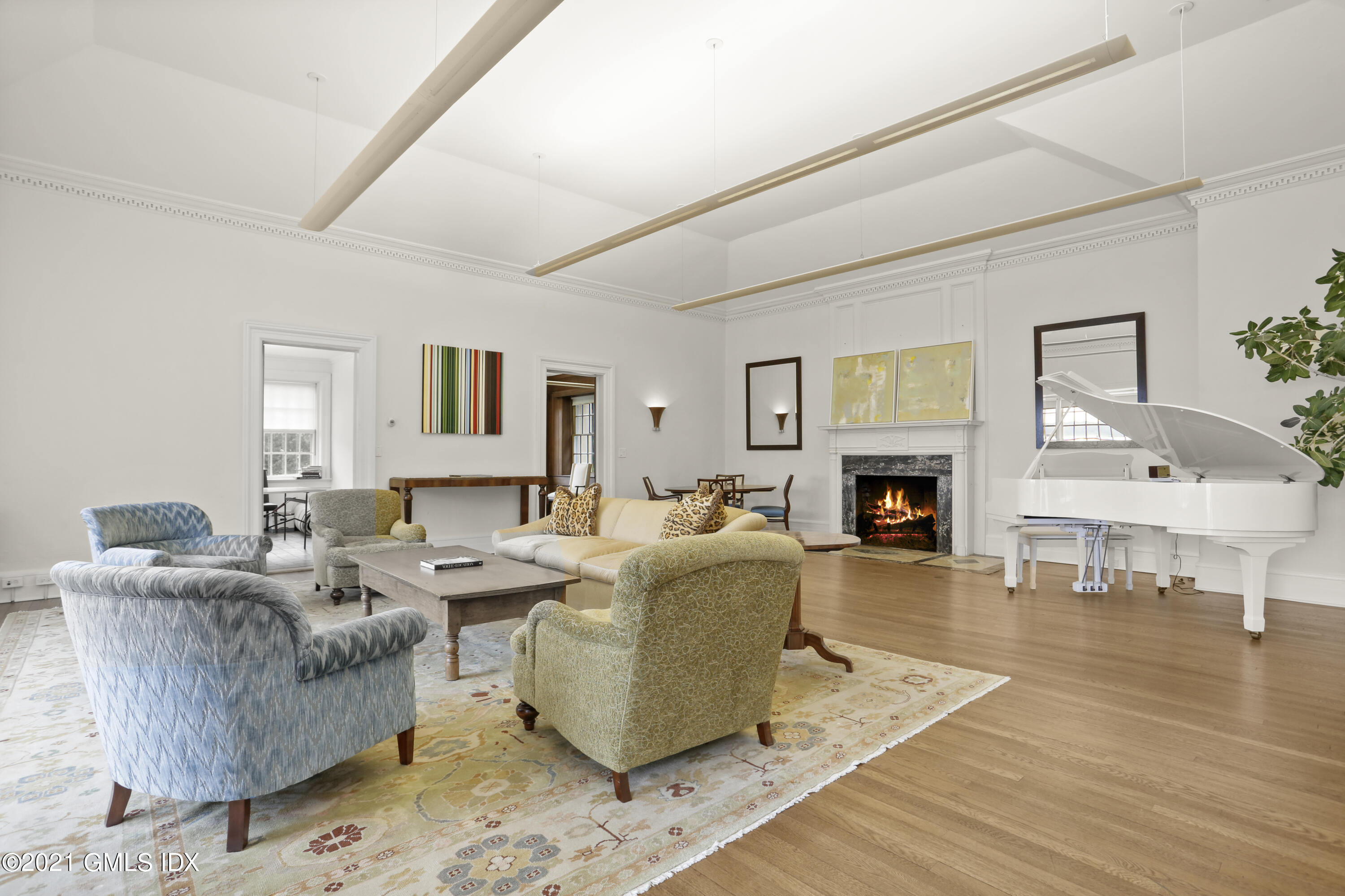 91 Indian Head Road Riverside, CT 06878 - Photo 10 of 45 a living room with fireplace furniture and a wooden floor