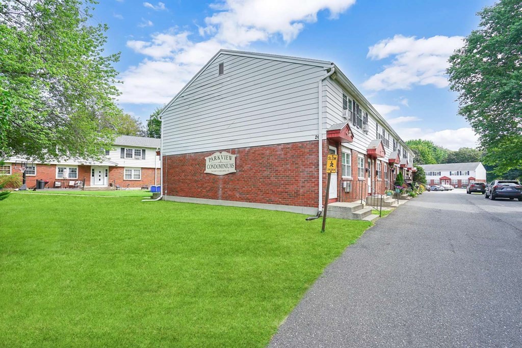 269 Chicopee Street, Unit 17 Chicopee, MA 01013 - Photo 19 of 19 a view of a house with a yard and sitting area