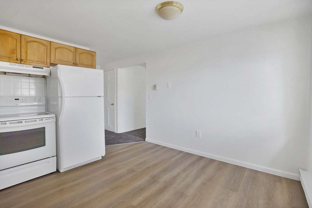 269 Chicopee Street, Unit 17 Chicopee, MA 01013 - Photo 4 of 19 a view of a kitchen with a sink refrigerator and cabinets
