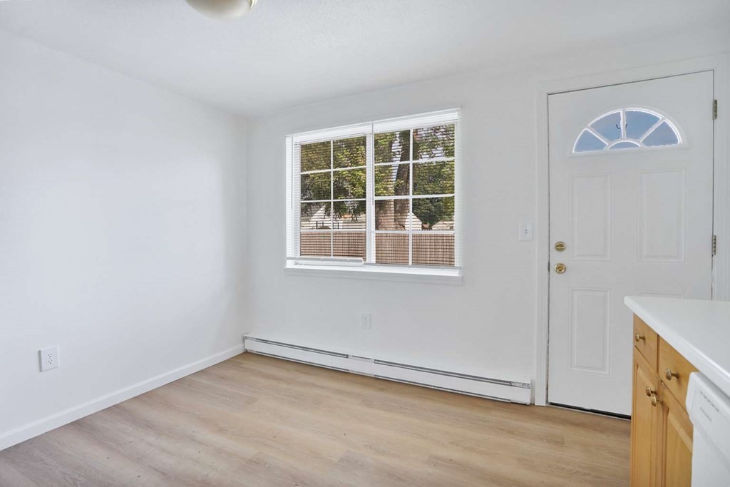 269 Chicopee Street, Unit 17 Chicopee, MA 01013 - Photo 5 of 19 a view of an empty room with a window and wooden floor