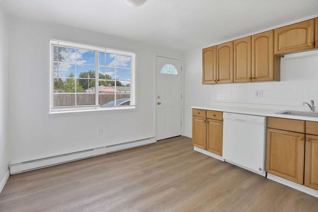 269 Chicopee Street, Unit 17 Chicopee, MA 01013 - Photo 6 of 19 a view of a kitchen with wooden floor and windows