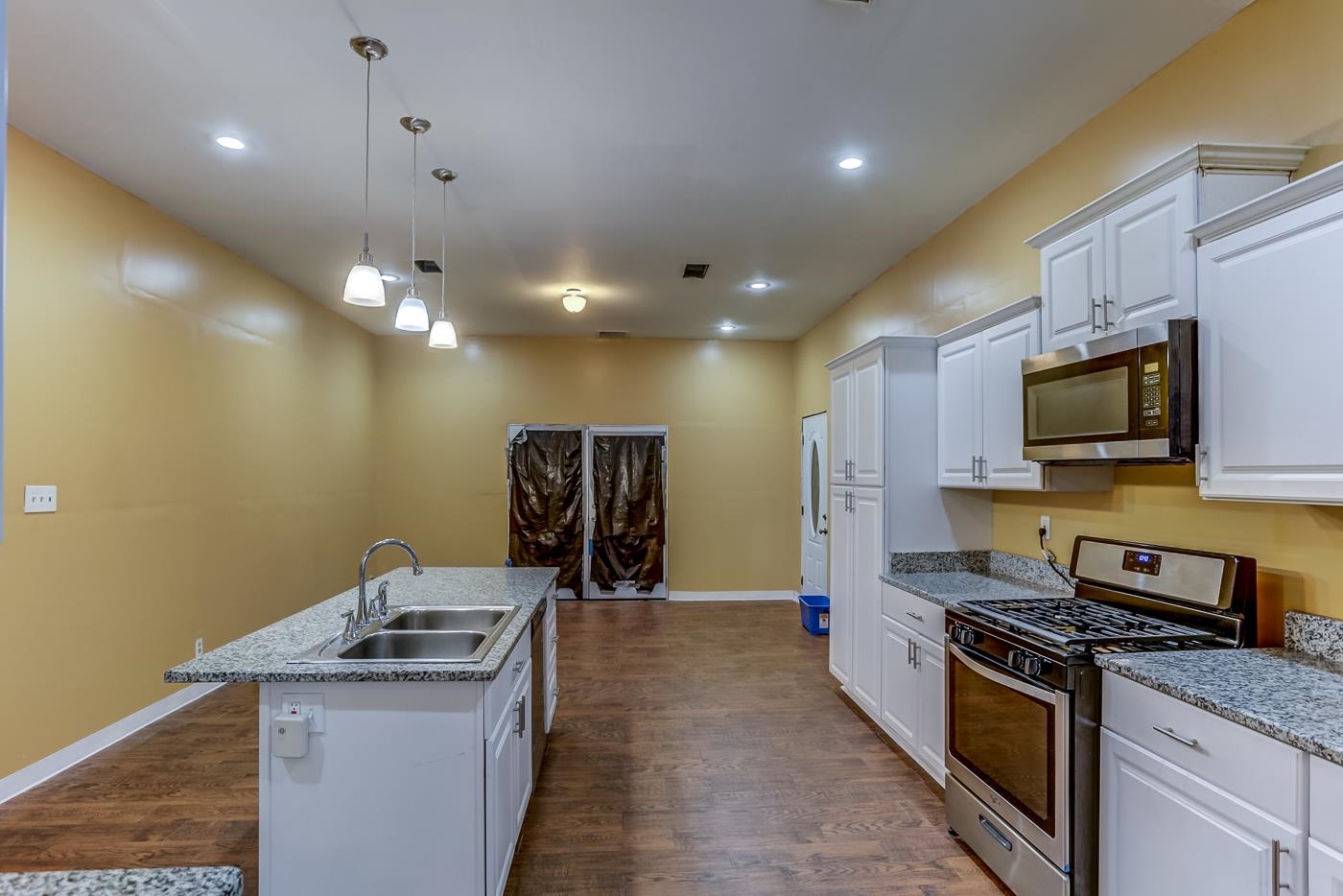 760 Craft Road Memphis, TN 38116 - Photo 12 of 25 a kitchen with stainless steel appliances granite countertop a sink and a stove