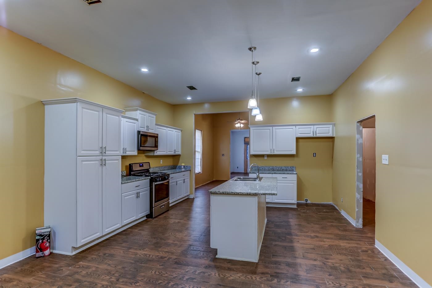 760 Craft Road Memphis, TN 38116 - Photo 13 of 25 a large kitchen with cabinets and stainless steel appliances