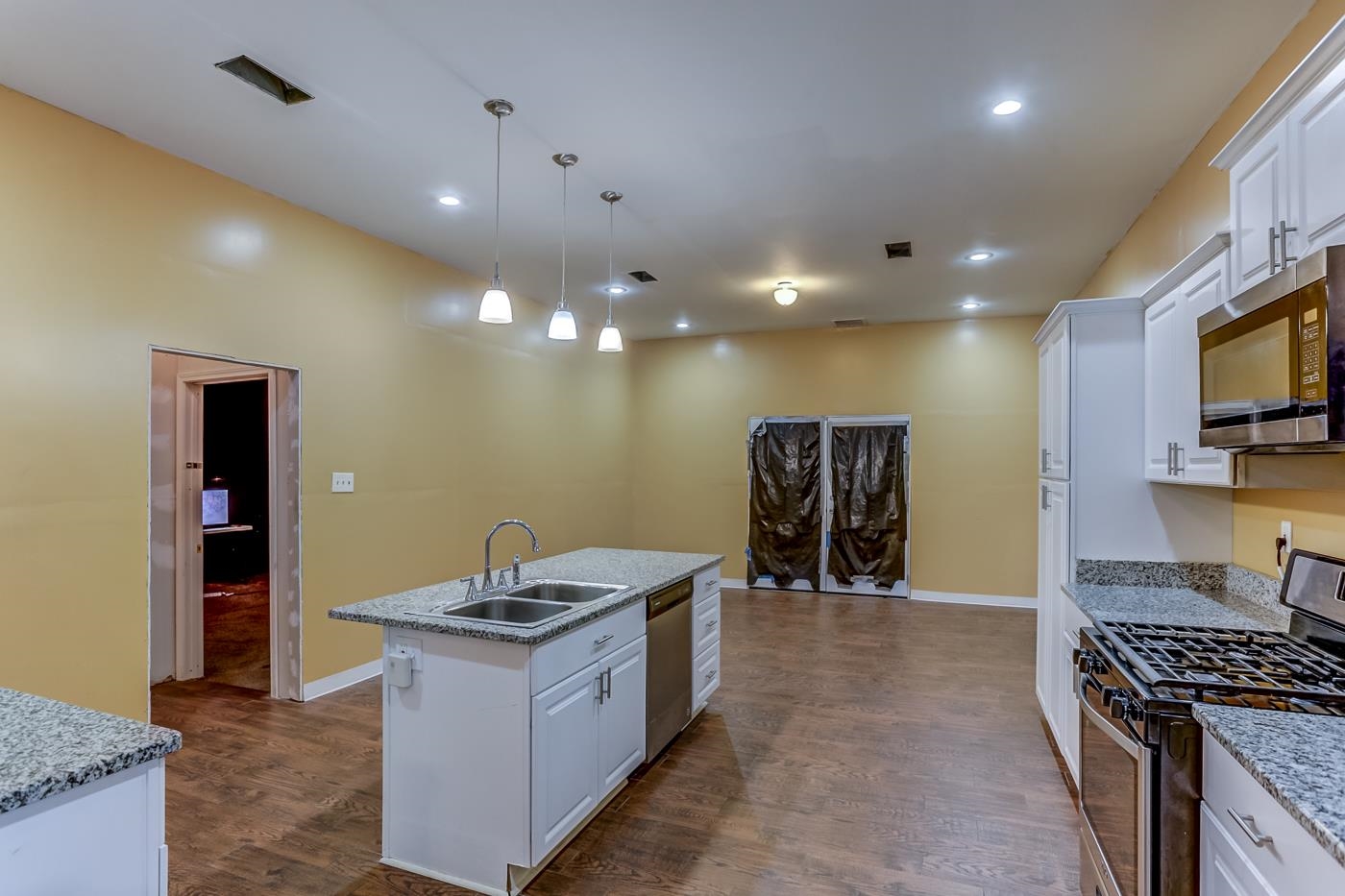 760 Craft Road Memphis, TN 38116 - Photo 14 of 25 a kitchen with stainless steel appliances granite countertop a stove and a sink