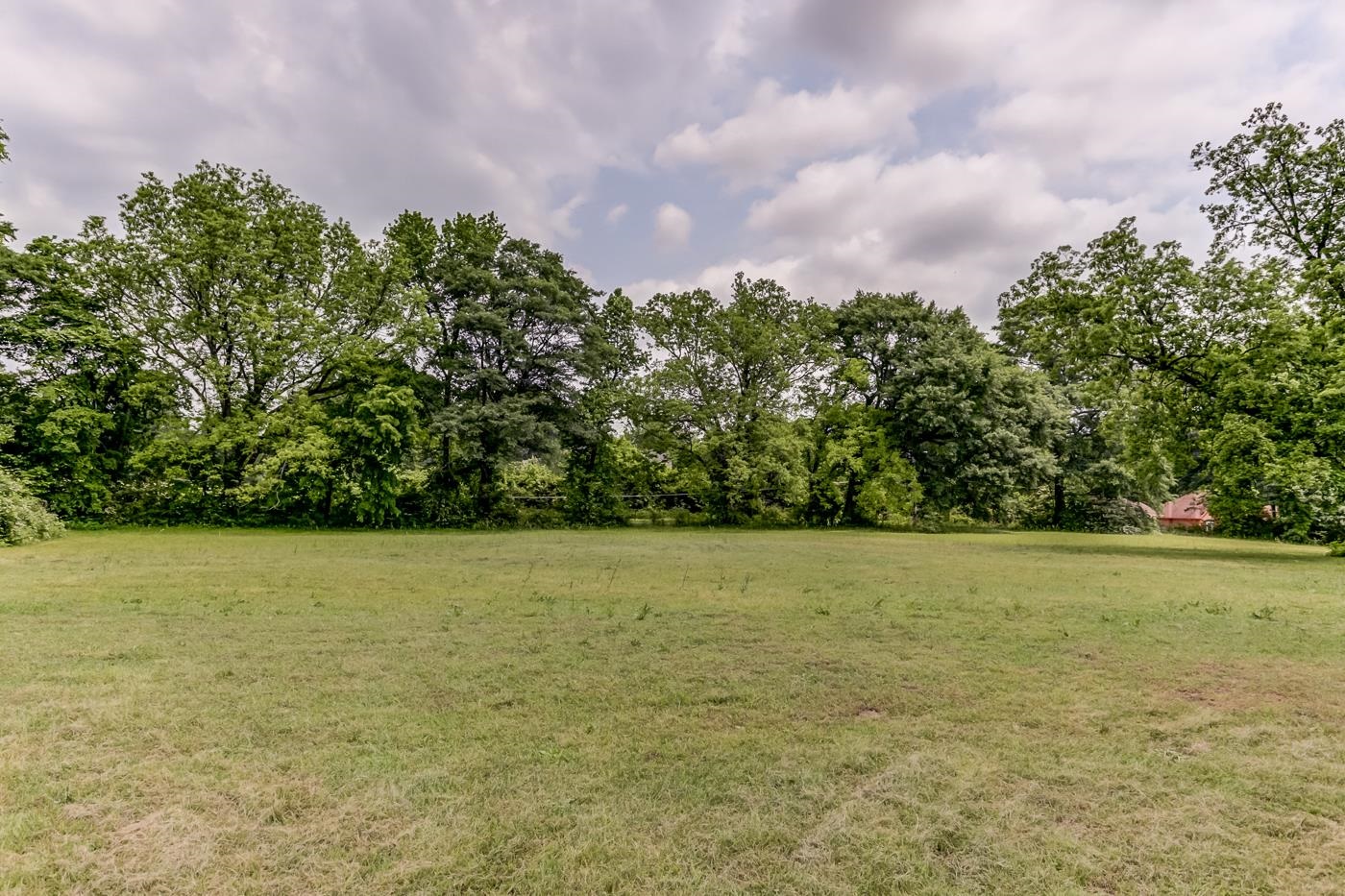 760 Craft Road Memphis, TN 38116 - Photo 4 of 25 a view of a field with an trees