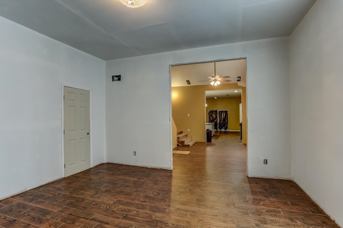 760 Craft Road Memphis, TN 38116 - Photo 9 of 25 a view of a room with wooden floor and a hallway