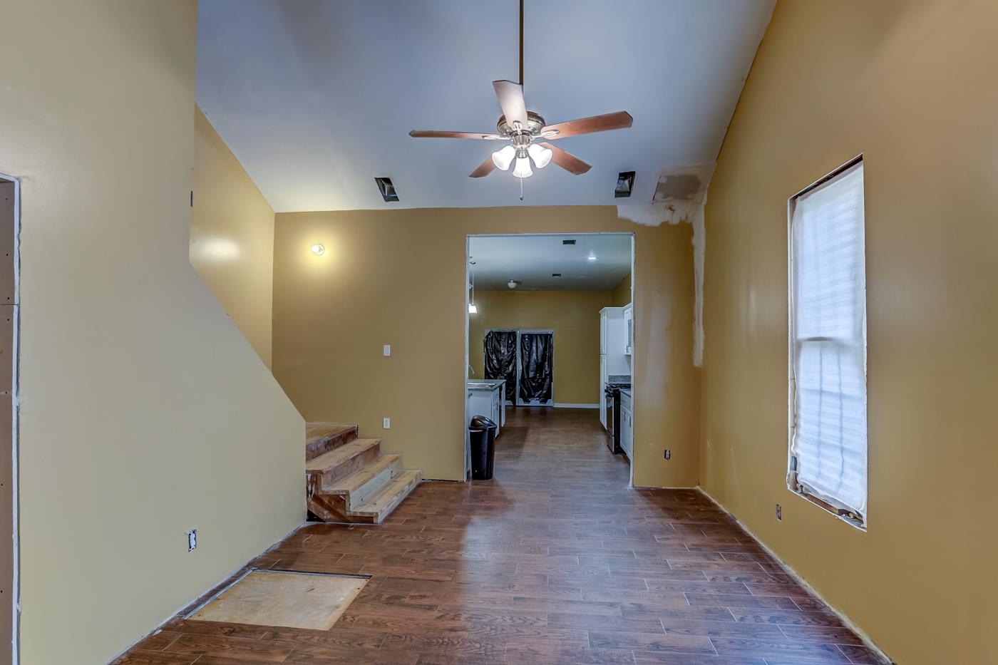 760 Craft Road Memphis, TN 38116 - Photo 10 of 25 a view of a hallway with wooden floor and staircase