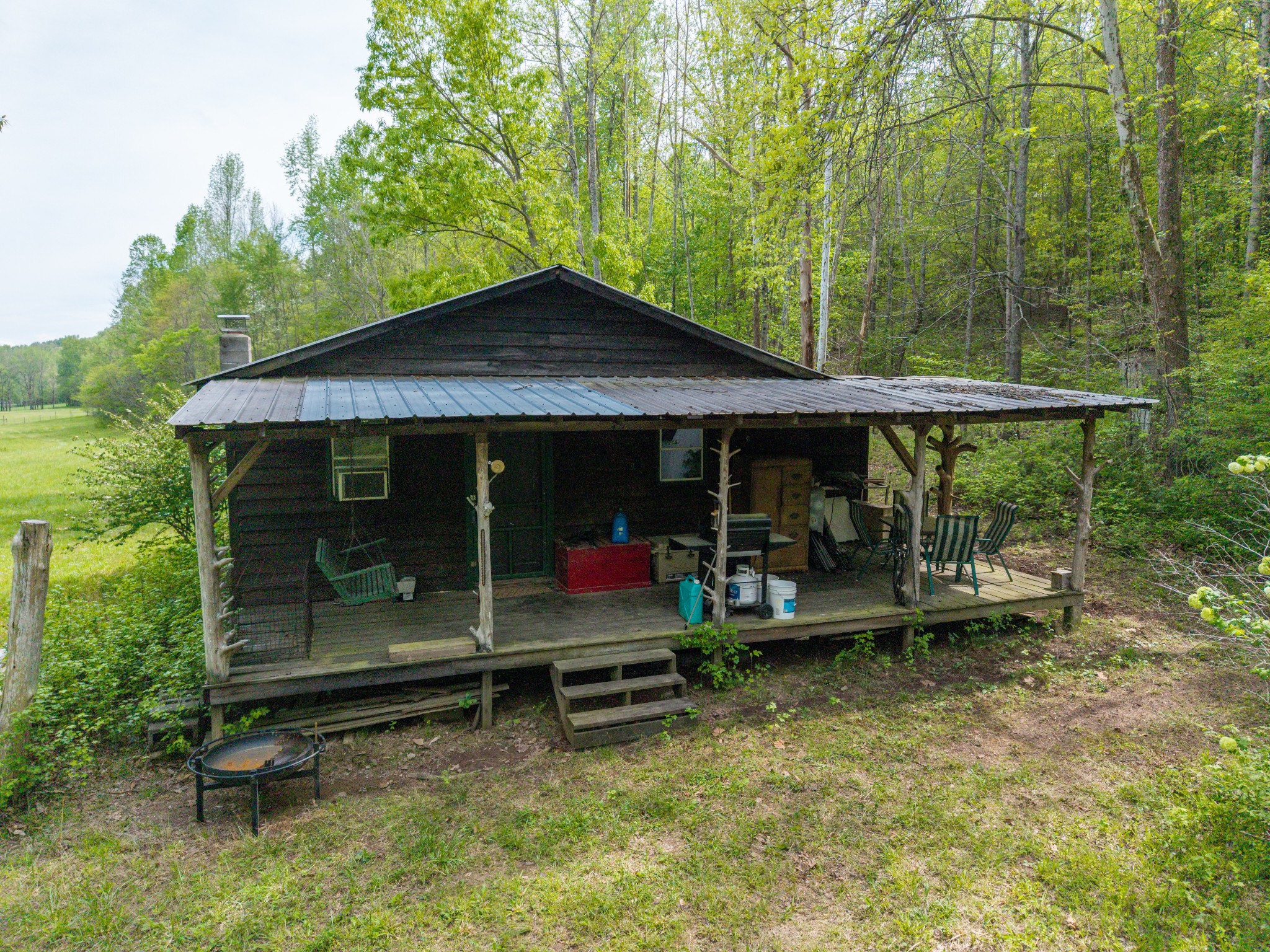 965 Flag Springs Road Lynnville, TN 38472 - Photo 11 of 56 a backyard of a house with barbeque oven table and chairs