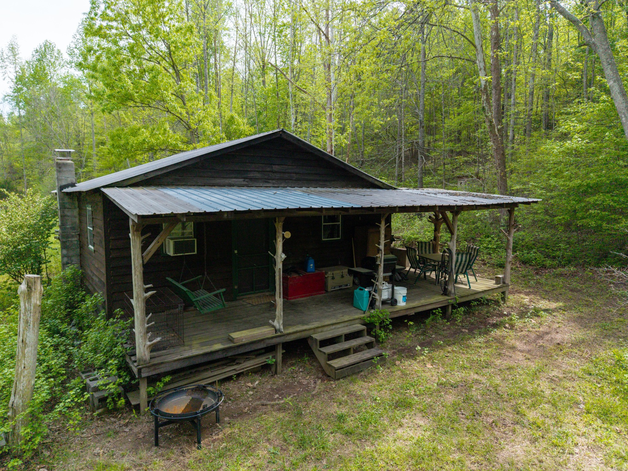 965 Flag Springs Road Lynnville, TN 38472 - Photo 12 of 56 a backyard of a house with barbeque oven table and chairs