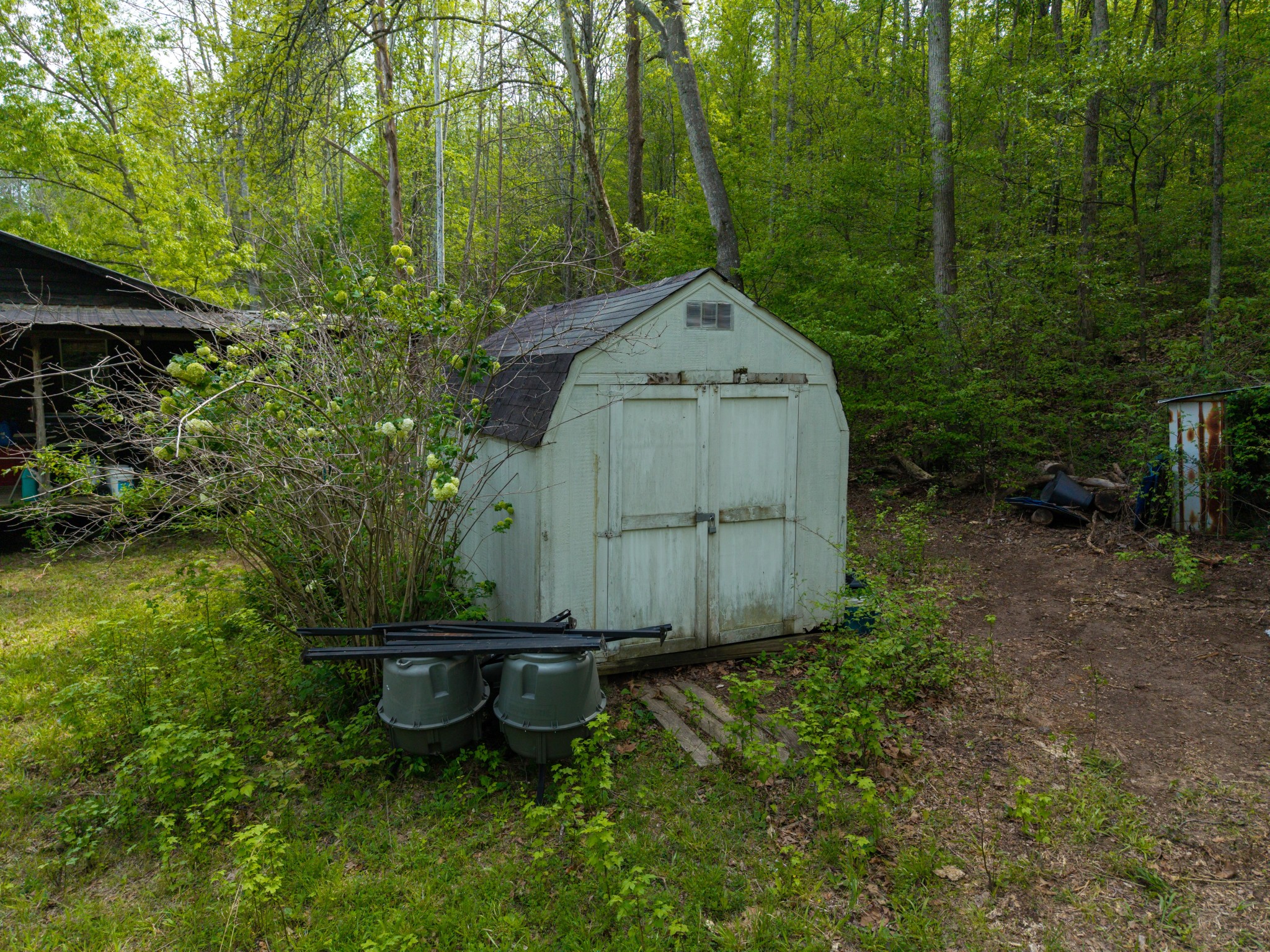 965 Flag Springs Road Lynnville, TN 38472 - Photo 14 of 56 a backyard of a house with table and chairs