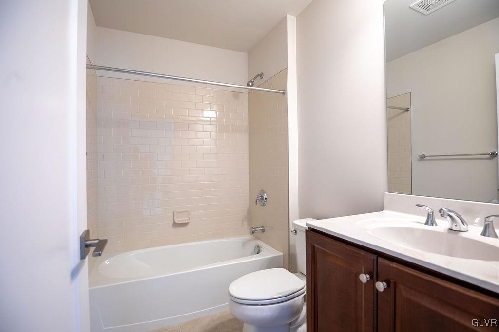 7013 Oak Lane Bath, PA 18014 - Photo 13 of 35 a bathroom with a granite countertop sink toilet and shower