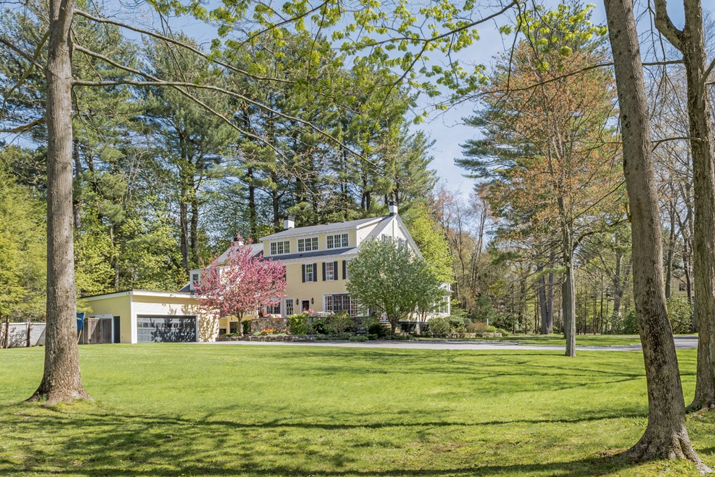 16 Walnut Road Wenham, MA 01984 - Photo 14 of 14 a front view of a house with a garden