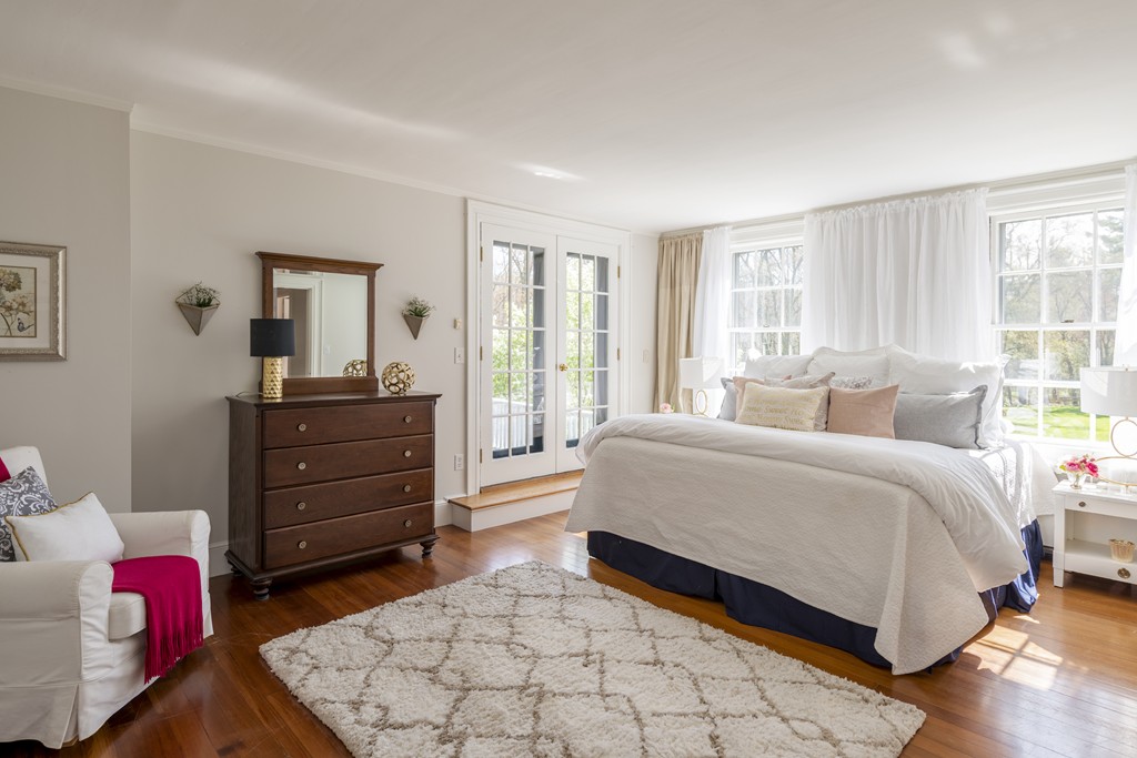 16 Walnut Road Wenham, MA 01984 - Photo 8 of 14 a spacious bedroom with a bed and a dresser