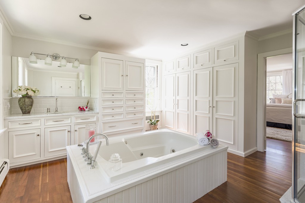 16 Walnut Road Wenham, MA 01984 - Photo 9 of 14 a bathroom with a tub a double vanity sink and mirror