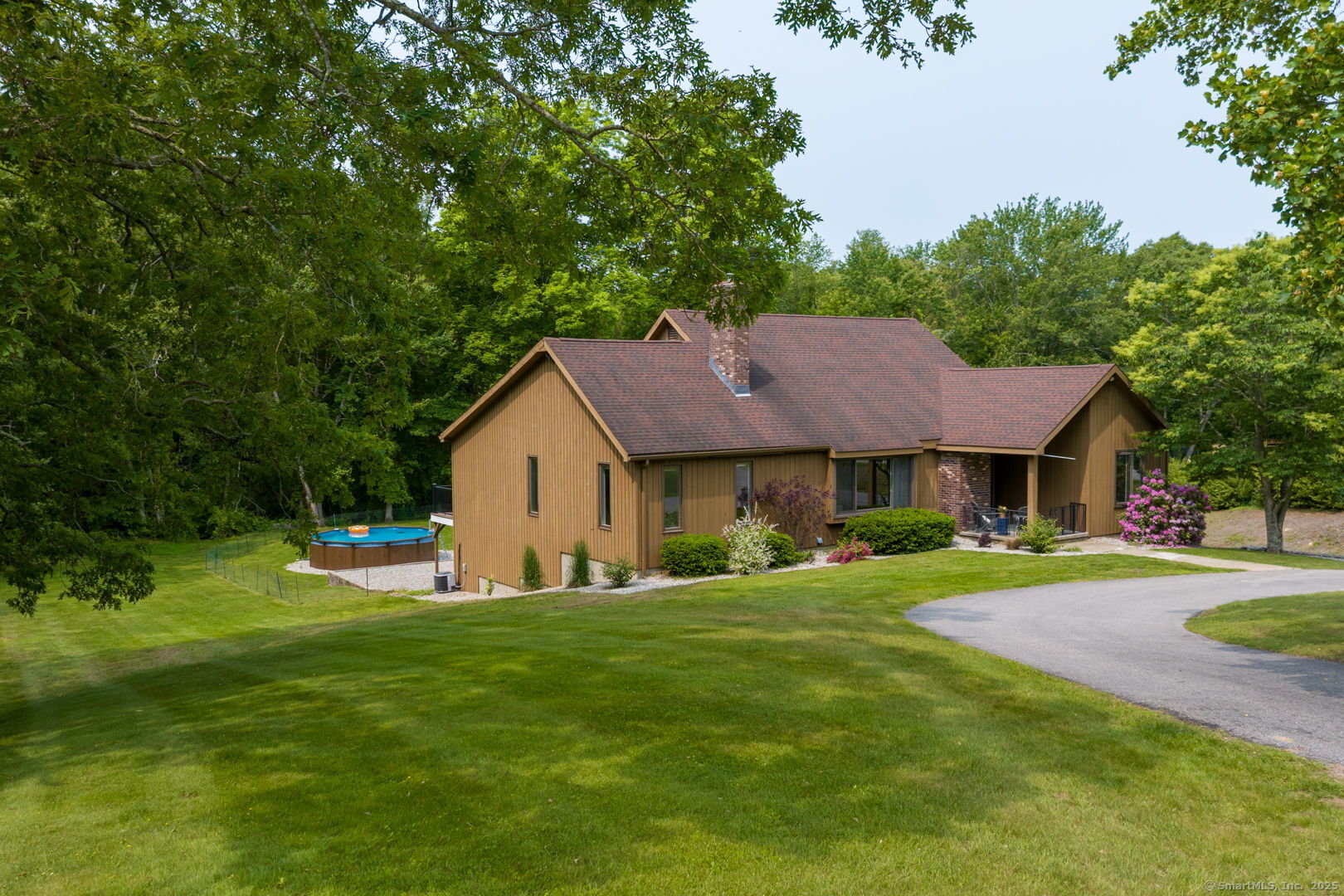 a front view of a house with a garden