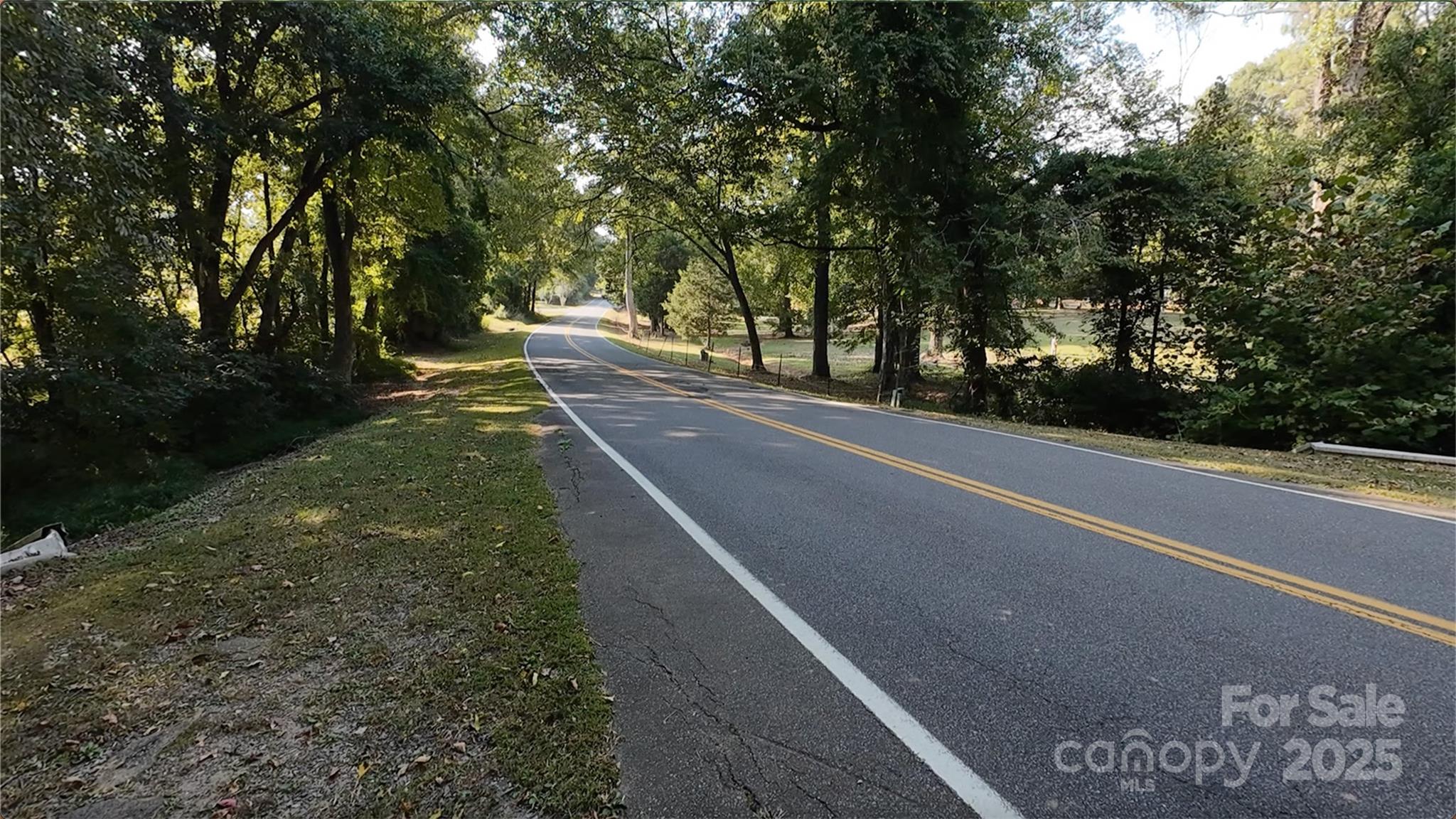 3943 Walker Road Rock Hill, SC 29730 - Photo 9 of 14 a view of a street with trees on both side of it