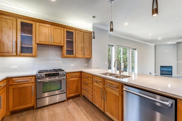 a kitchen with a sink stove and microwave