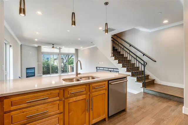 a kitchen with sink and windows