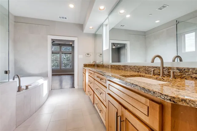 a large kitchen with a sink and a stove top oven