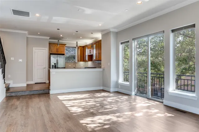 a view of a kitchen with a sink and a window