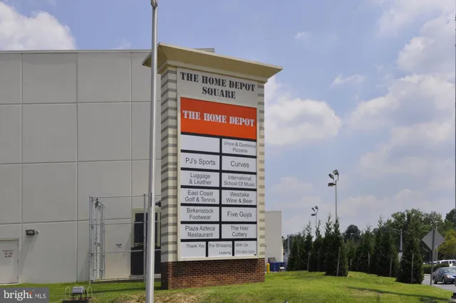 a view of a building with backyard and garden