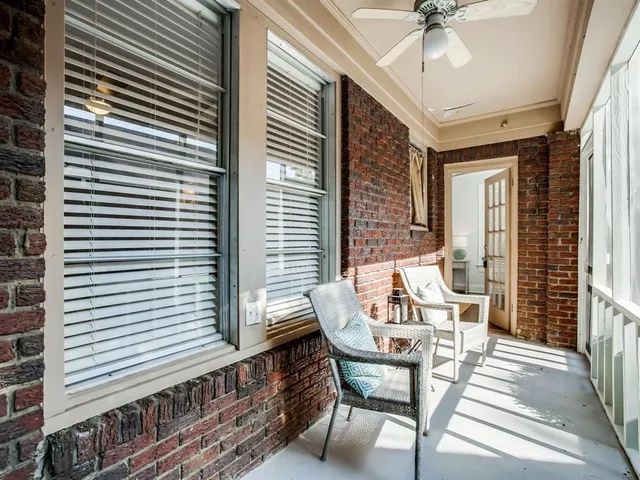 a view of a dining room with furniture and a window